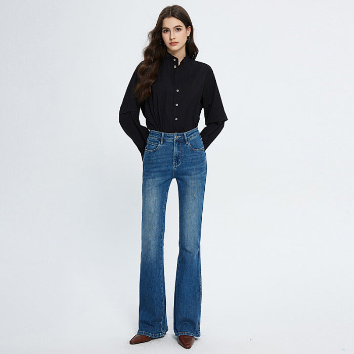 Woman wearing HD blue high waist stretch skinny jeans with medium elastic and flared pant legs
