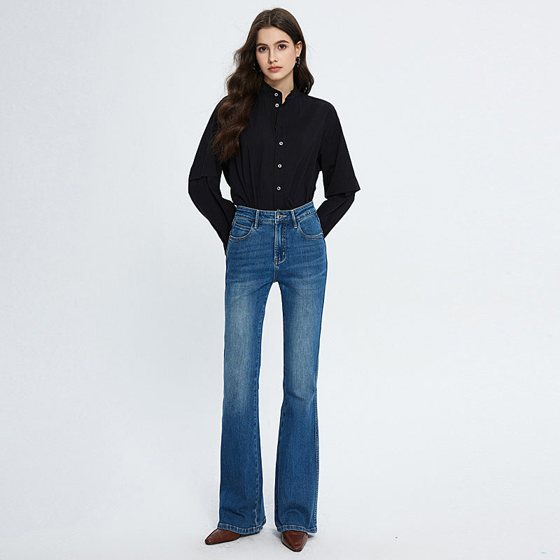 Woman wearing fashionable stretch skinny high waist blue jeans with medium elastic cotton fabric and long trousers length