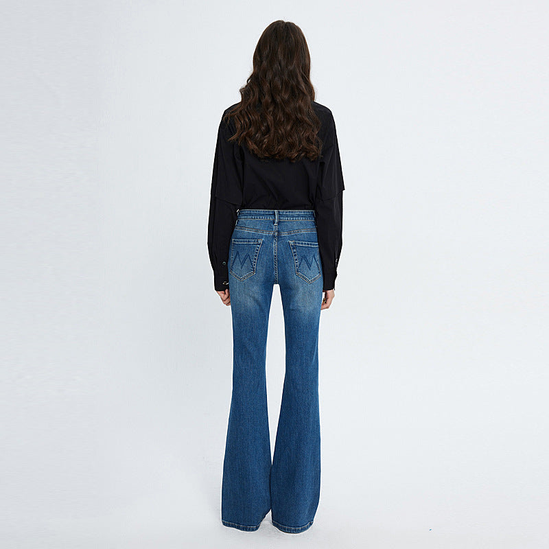Woman wearing HD blue high waist fashionable stretch skinny jeans with medium elasticity viewed from the back